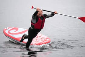Liberal Democrats Leader Ed Davey intentionally falls off a paddleboard on Lake Windermere (Photo by Christopher Furlong/Getty Images)
