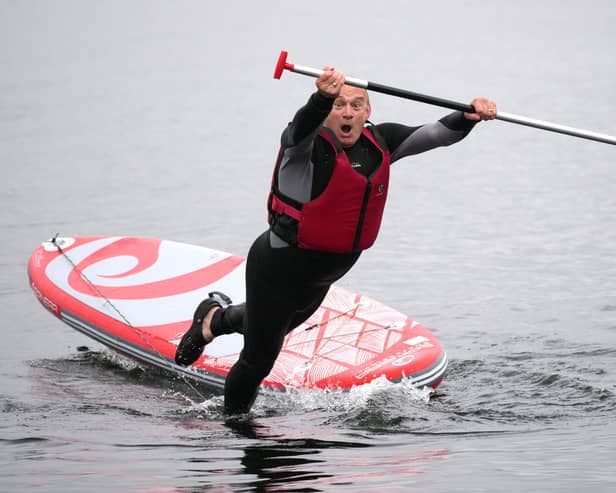 Liberal Democrats Leader Ed Davey intentionally falls off a paddleboard on Lake Windermere (Photo by Christopher Furlong/Getty Images)