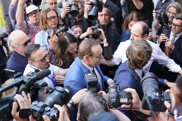 Surrounded by members of his legal team and two police officers, Kevin Spacey was mobbed by hordes of photographers as he exited a silver Mercedes outside Westminster Magistrates’ Court.