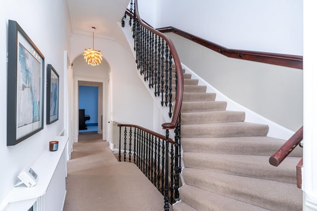 The eye-catching staircase in this bright and spacious property.