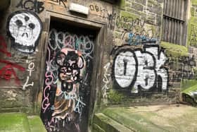 Graffiti in Milne’s Court off Edinburgh's Royal Mile (Picture: Donald Anderson)