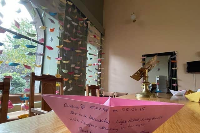 Mrs Taylor-Wintersgill's note is one of around 2,000 origami boats hung up inside St Andrews High Church and Northesk Parish Church in Musselburgh for an instillation called "Love and Loss". Issue date: Thursday November 11, 2021.