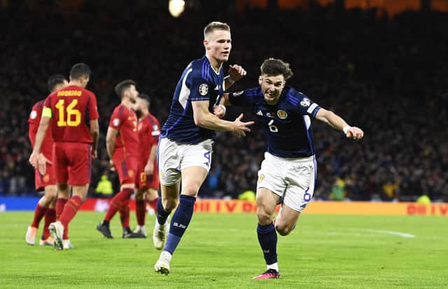 Scott McTominay celebrates with Kieran Tierney after making it 2-0 to Scotland during the European Championships qualifier against Spain. Picture: SNS