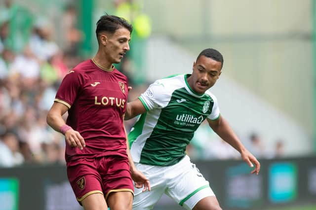 Allan Delferriere in action against Dimitris Giannoulis during the pre-season friendly between Hibs and Norwich City