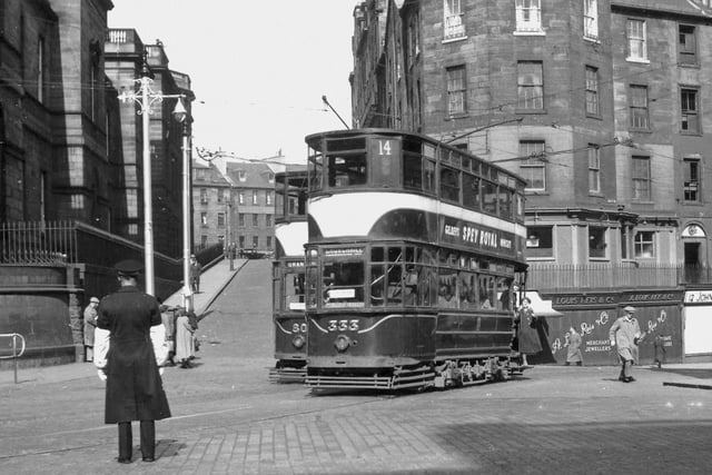 Old Edinburgh tram No. 333, on Service 14 to Churchhill, is seen turning into Princes Street at the top of Leith Street in the 1950s at the site where The St James Quarter now stands.