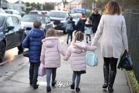 File photo dated 17/01/20 of parents walking their children to school in Hornchurch, Essex. The Government is being urged to put family at the centre of policy-making, as the Children's Commissioner for England published a key report on the make-up of UK families. Issue date: Thursday September 1, 2022. PA Photo. Dame Rachel de Souza has urged the incoming Conservative leader's administration to "prioritise" putting families "at the heart" of policy-making, as she warned in a new Government-commissioned report that gaps in official data fail to capture families as they see themselves. See PA story POLITICS Families. Photo credit should read: Nicholas.T. Ansell/PA Wire 