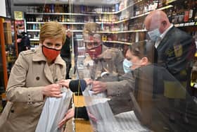 First Minister Nicola Sturgeon visits T.B Watson Specialist whisky & wine merchant as she campaigns in Midsteeple Quarter for the Scottish Parliament election. Picture: Jeff J Mitchell-WPA Pool/Getty Images