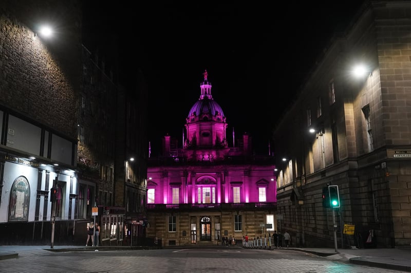 The Lloyds head office building on The Mound lit up in pink in support of the Walk the Walk charity and all those taking part.