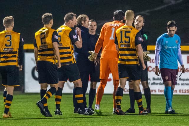 Hearts manager Robbie Neilson (left) and Craig Gordon confront the referee Gavin Duncan at full time at Alloa.
