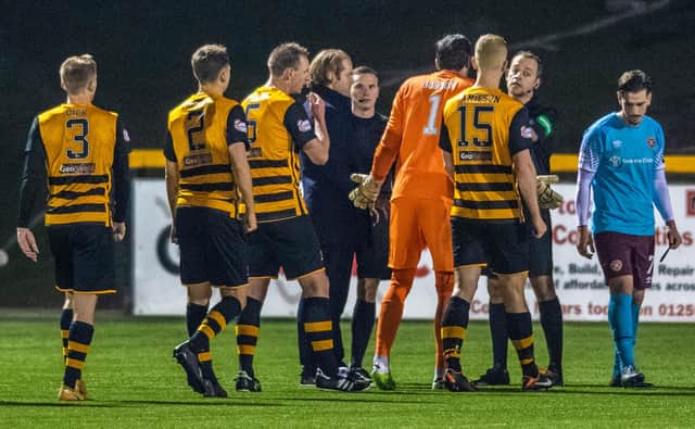 Hearts manager Robbie Neilson (left) and Craig Gordon confront the referee Gavin Duncan at full time at Alloa.