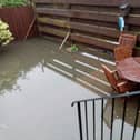 Rain water and sewage floods their back gardens
