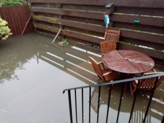 Rain water and sewage floods their back gardens