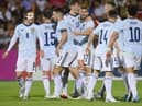 Stuart Armstrong is mobbed by his Scotland team-mates after brilliantly putting his side ahead against Armenia. Picture: AP