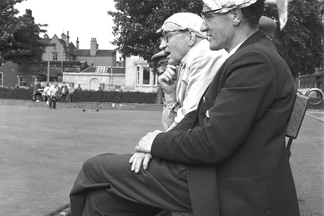 Charles Miller and Tom Heron use their handkerchiefs as sun hats at the St James bowling tournament in Leith in 1966.