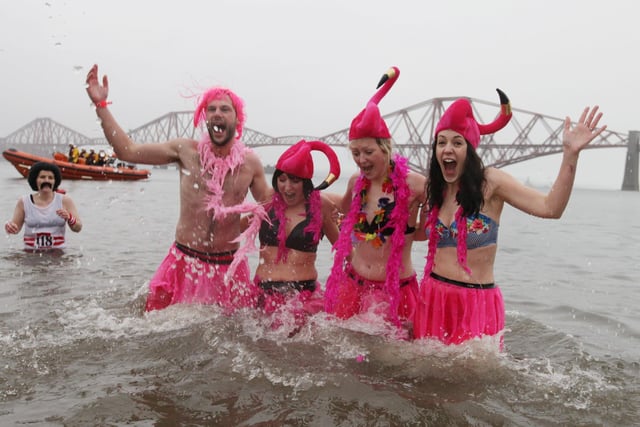 These four intrepid bathers donned fancy dress - and even fancier headgear - to take part in the 2015 Loony Dook.