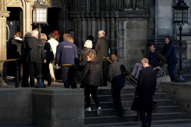 Members of the public enter St Giles' Cathedral, Edinburgh, to view and pay their respects to Queen Elizabeth II's coffin, which will lie at rest in the cathedral for 24 hours.