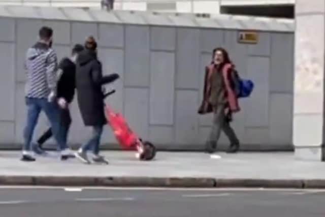 Woman in black coat stepping back to avoid being hit by an e-scooter after rider loses control while on a pavement. Picture: National Federation of the Blind of the UK