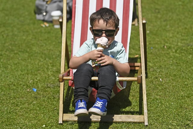Four-year-old Alfie McKelvie enjoys an ice  cream in Princes Street Gardens to cool down as the sun hits the Capital in June, 2019.