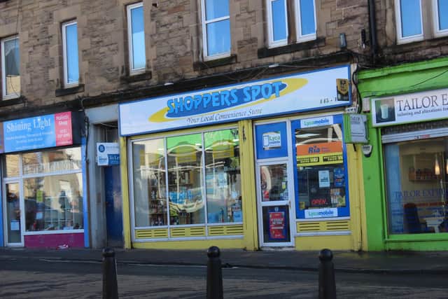 A shop worker fought off a knifeman in a violent struggle at the Shoppers Spot store in Dalry, Edinburgh.