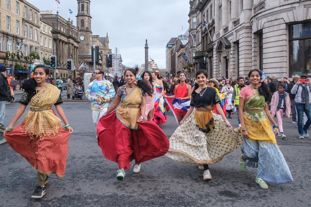 The vibrant and colourful procession through the city centre featured pipe bands, Bhangra dancers, folk dancers and drummers.