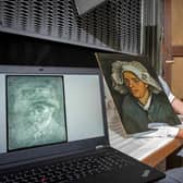 Senior conservator Lesley Stevenson viewing "Head of a Peasant Woman" alongside an X-ray image of a hidden self-portrait of Dutch painter Vincent Van Gogh in Edinburgh. (Photo by NEIL HANNA/National Galleries of Scotland/AFP via Getty Images)