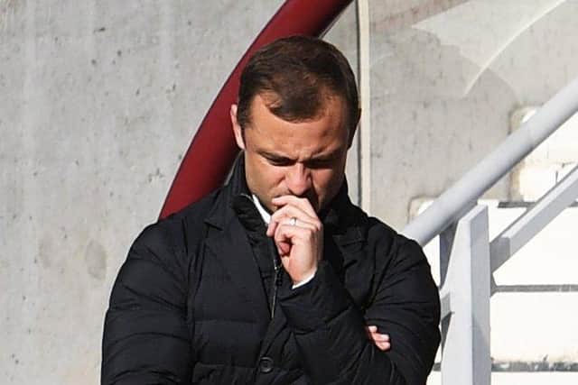 Hibs manager Shaun Maloney cuts a dejected figure at Tynecastle Park