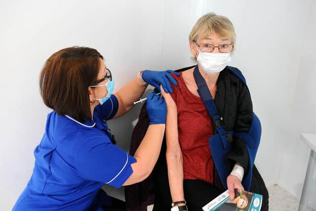 Sharon Davis, Practice Nurse Meeks Road Surgery gives a vaccination to Maureen MacDonald 72 from Maddiston. Photo by Michael Gillen