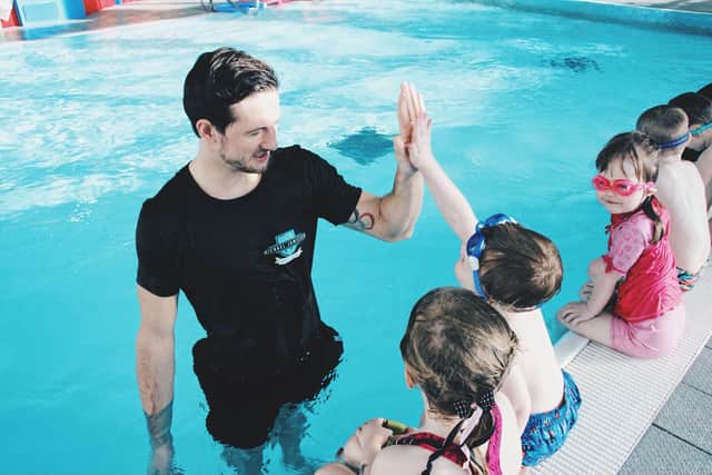 Michael gets a 'high-five' during one lesson for youngsters