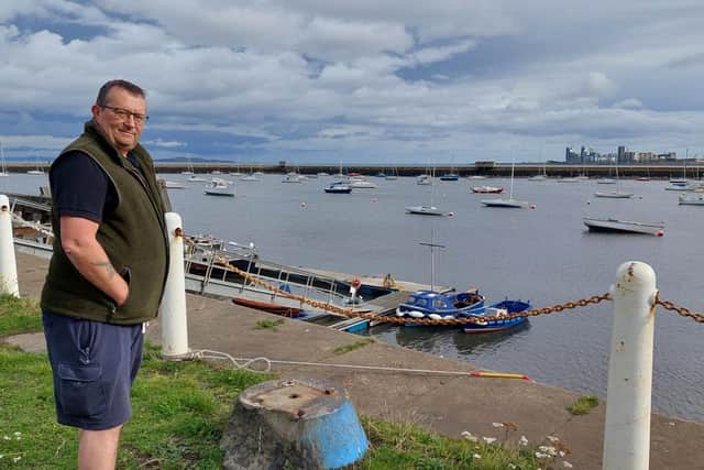 Ian Campbell at Granton Harbour with Newhaven in the background. By Nigel Duncan
