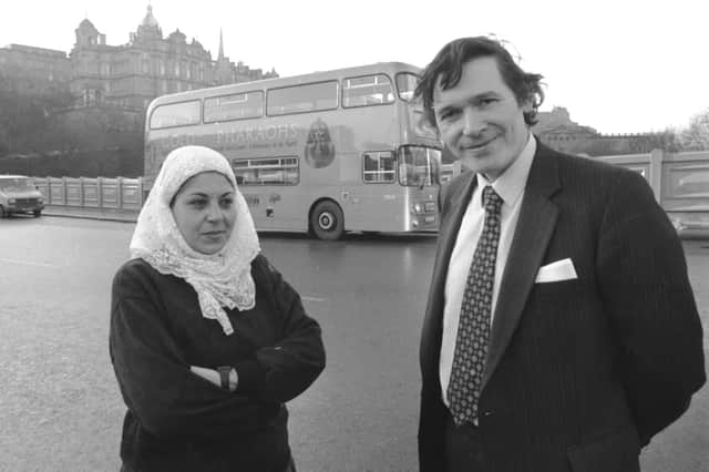 A curator from Cairo museum and Herbert Coutts in front of the gold LRT bus promoting the Gold of the Pharaohs exhibition at the City Art Centre in Edinburgh, January 1988.
