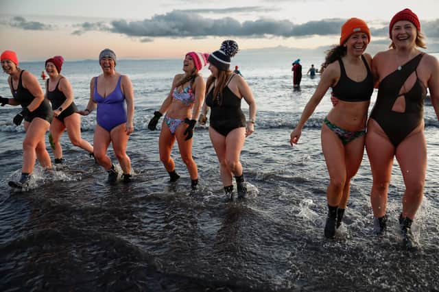 Hundreds of swimmers took a sunrise dip off Portobello Beach as part of a series of events to mark International Women’s Day (Picture: Jeff J Mitchell/Getty Images)