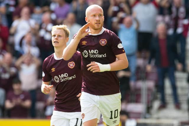 Liam Boyce celebrates scoring for Hearts against St Johnstone but he was later stretchered off.