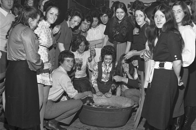 A Halloween party held at Lauriston community centre in October 1970, with those in attendance dooking for apples.