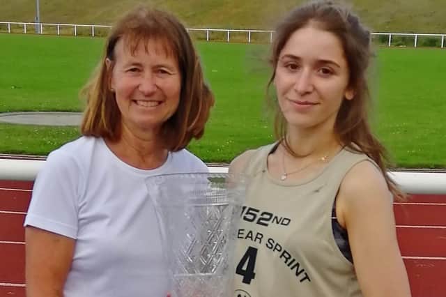 Molly Renshaw, with coach Linda Nicholson, after her New Year Sprint 2021 triumph