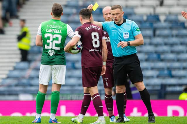John Beaton shows the yellow card to Hibs midfielder Josh Campbell during last year's Scottish Cup semi-final at Hampden Park. Picture: SNS