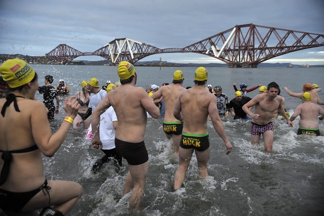 Intrepid Loony Dookers wade into the water at South Queensferry for the 2011 New Year dip.