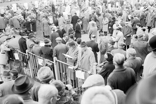 Punters queue up to bet at Musselburgh Races in April 1962.
