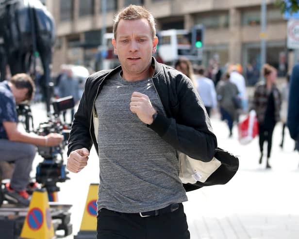 Actor Ewan McGregor on the streets of Edinburgh filming scenes in July 2016 for the sequel Trainspotting T2. He is pictured emulating the famous chase scene through the city centre in the original movie, with the chase starting on Princes Street and ending on Calton Road.