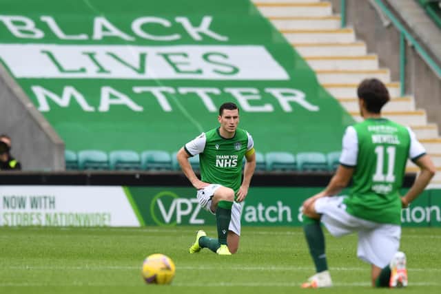 Hibs Paul Hanlon and Joe Newell take the knee as part of the ongoing battle against racism. Photo by Craig Foy / SNS Group