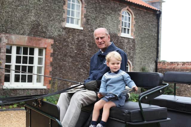 The Duke of Edinburgh with Prince George, taken by the Duchess of Cambridge in Norfolk in 2015.