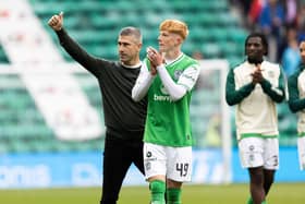 Hibs manager Nick Montgomery and Rory Whittaker applaud fans after beating St Johnstone.