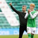 Hibs manager Nick Montgomery and Rory Whittaker applaud fans. 