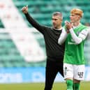 Hibs manager Nick Montgomery and Rory Whittaker applaud fans. 