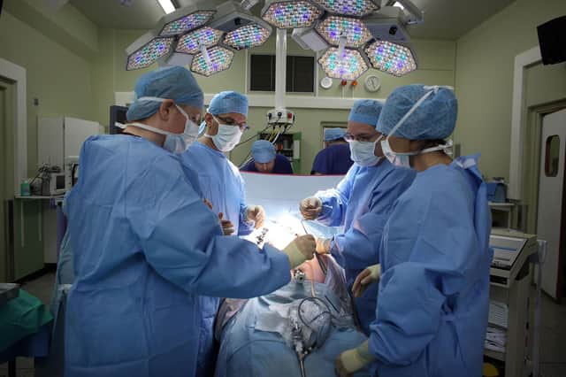 Surgery has come a long way since the days when they had to break down a toilet door to drag a patient to the operating table (Picture: Christopher Furlong/Getty Images)