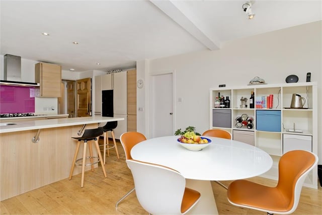 The kitchen has space for a dining table and chairs.