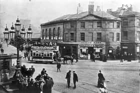 Leith Walk was a bustling street in 1898, with horse-drawn trams taking people to and fro and shoppers peering at George Marr's fruit and sweet shop's window displays.