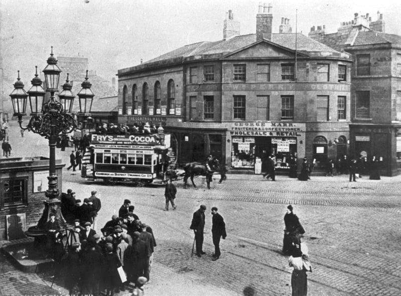 Leith Walk was a bustling street in 1898, with horse-drawn trams taking people to and fro and shoppers peering at George Marr's fruit and sweet shop's window displays.