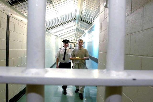 A prisoner carries a tray of food inside Saughton Prison in February, 2000.