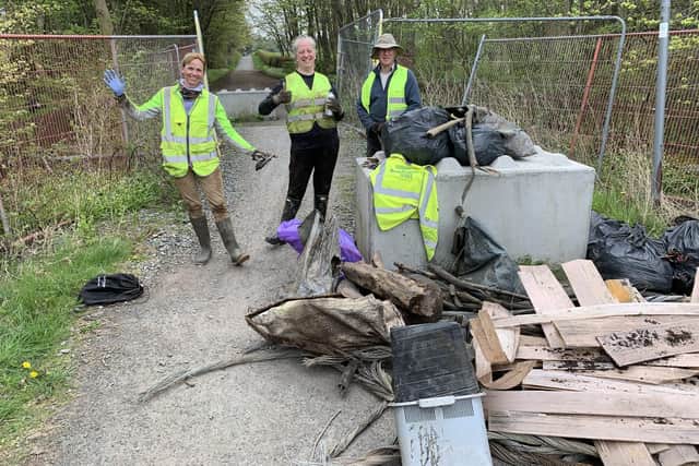 Volunteers with just some of the items removed from the burn after the clean-up.