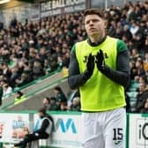 Kevin Nisbet applauds the fans as he warms up during Hibs' 6-0 victory over Aberdeen